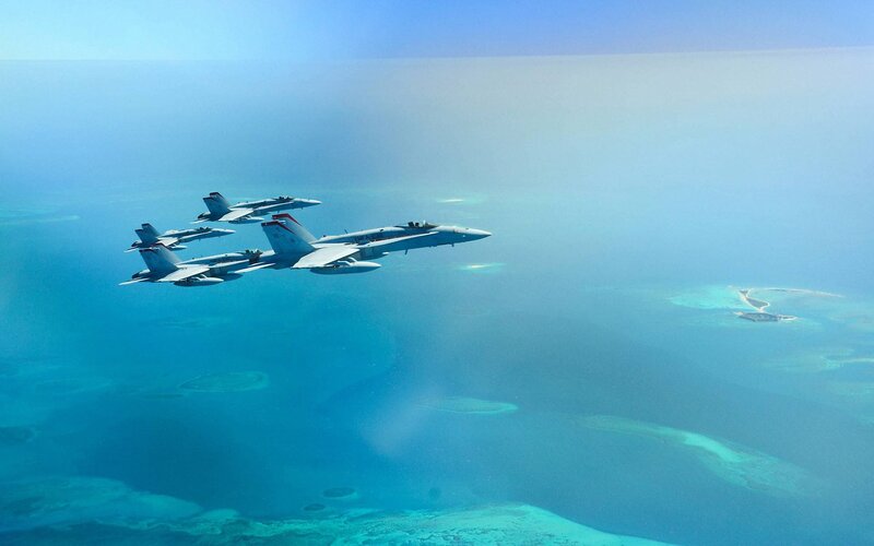 Fighter jets over coral reef