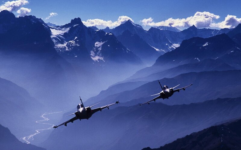Fighter jets over mountain range