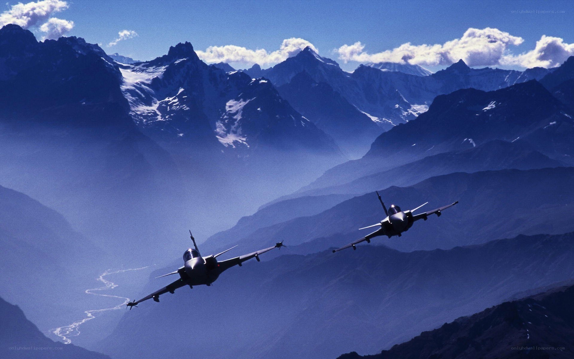 Fighter jets over mountain range