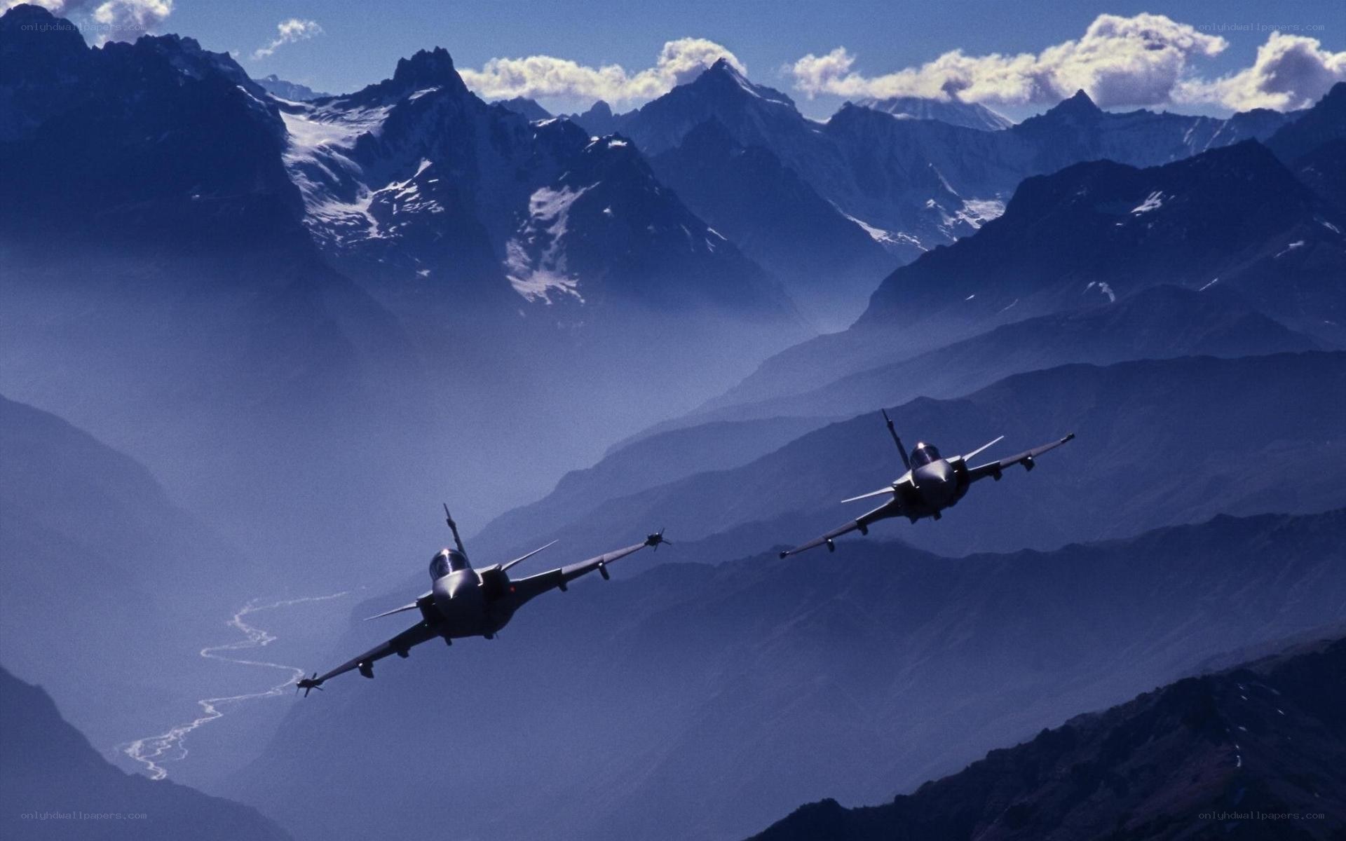 Fighter jets over mountain range