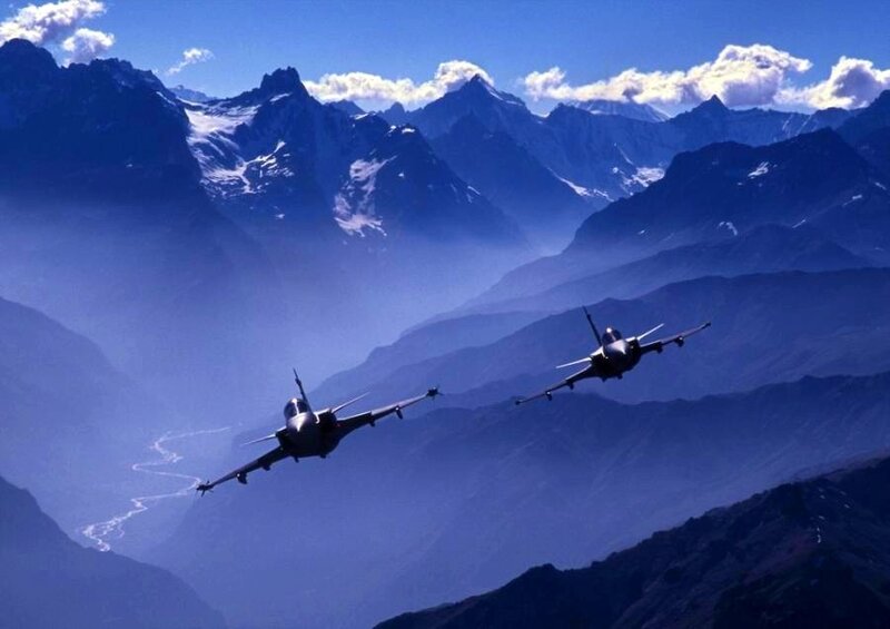 Fighter jets over mountain range