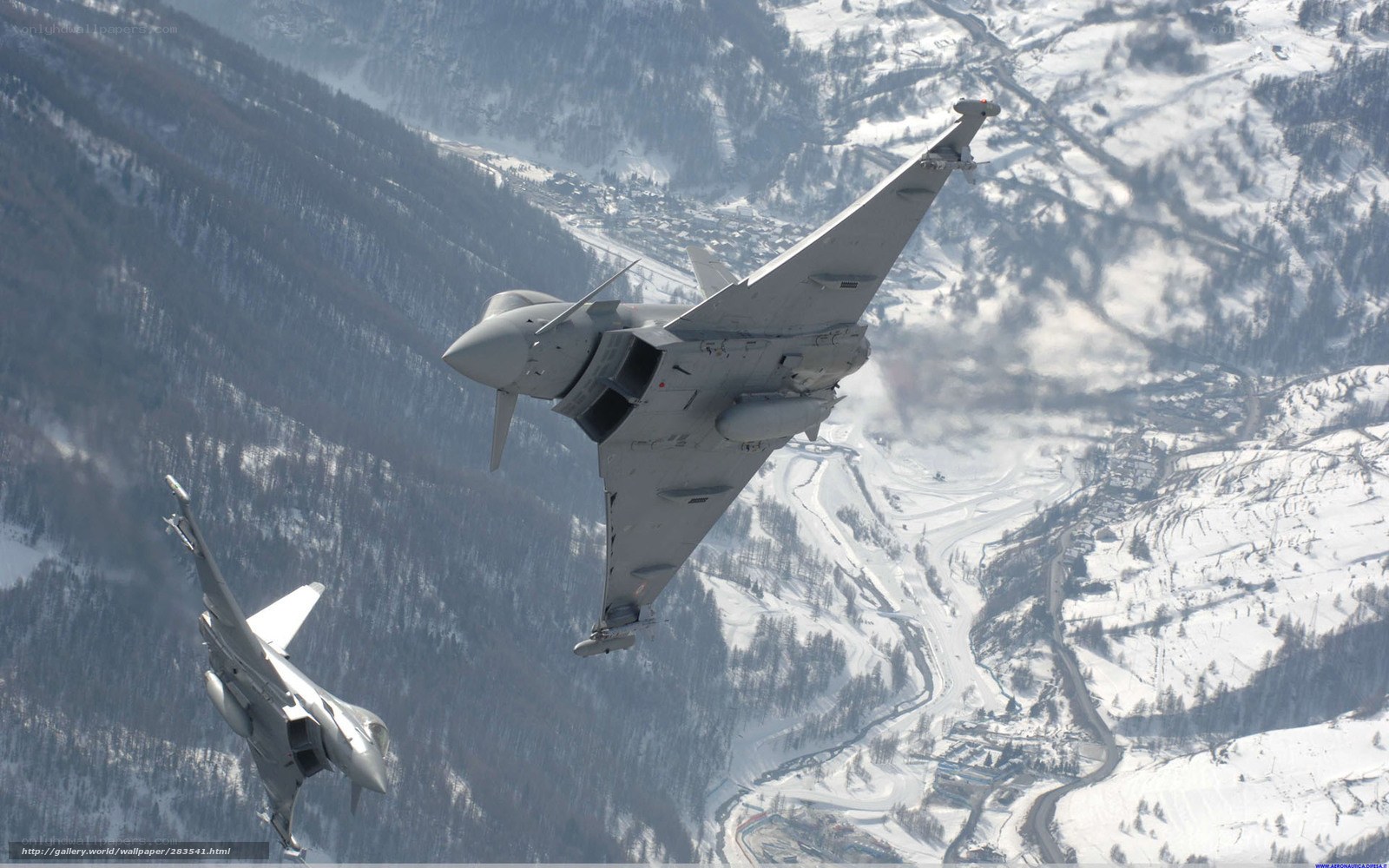 Fighter jets over snowy mountains