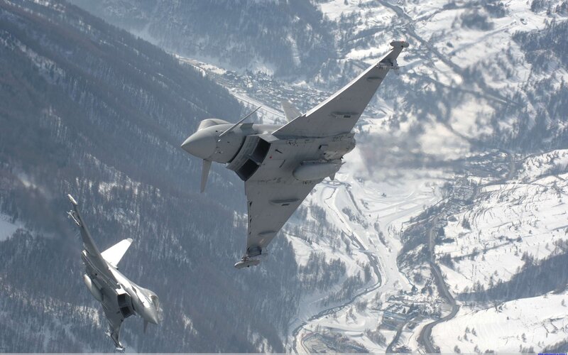 Fighter jets over snowy mountains