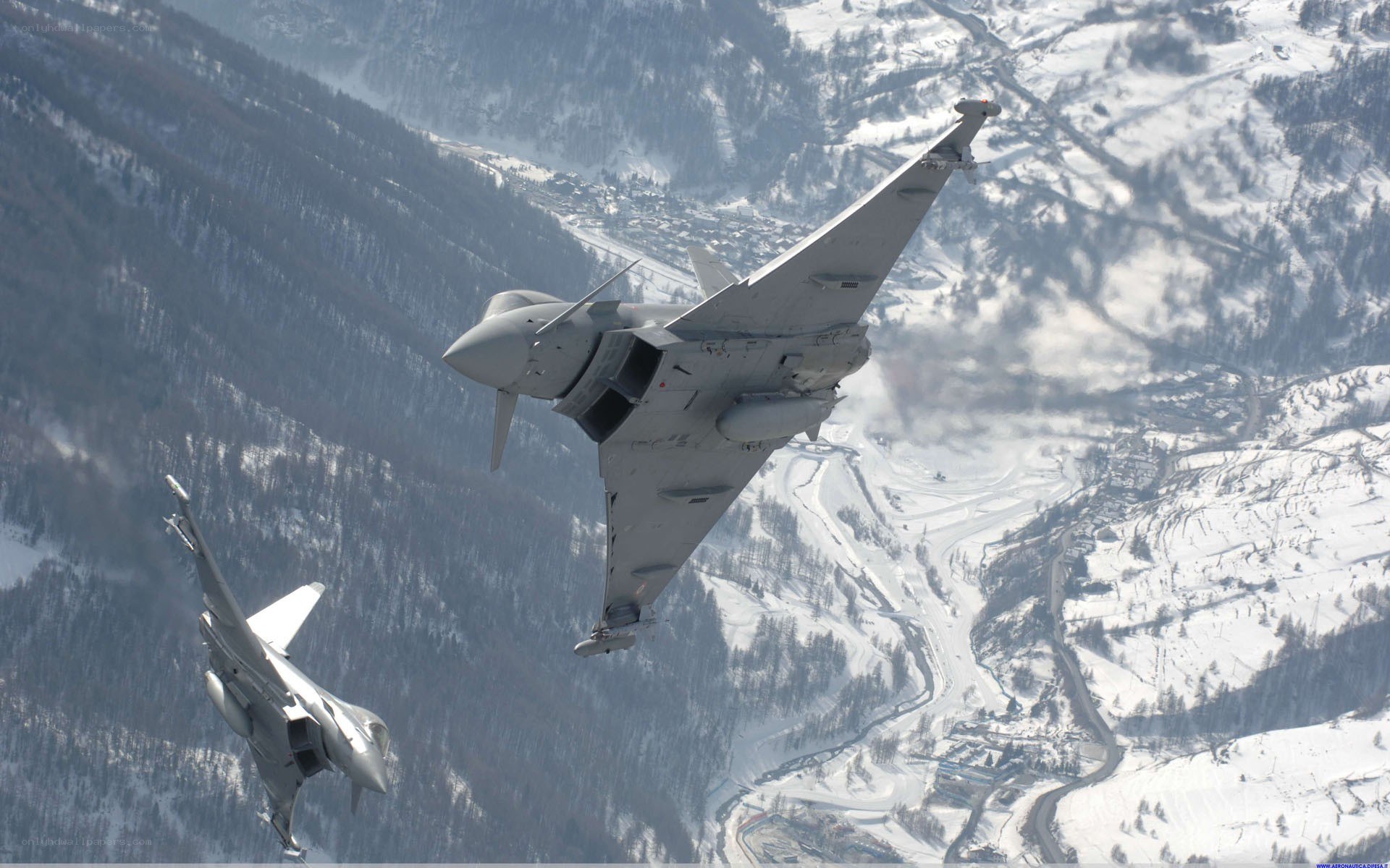 Fighter jets over snowy mountains