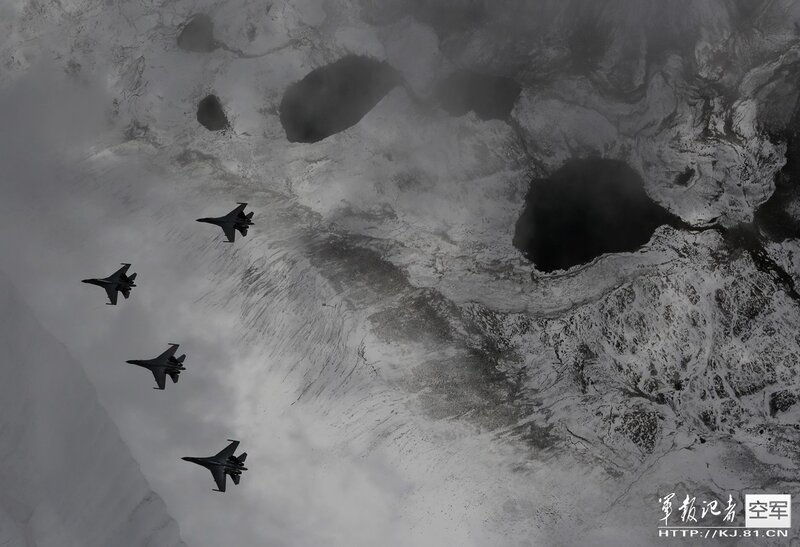 Fighter jets over snowy terrain