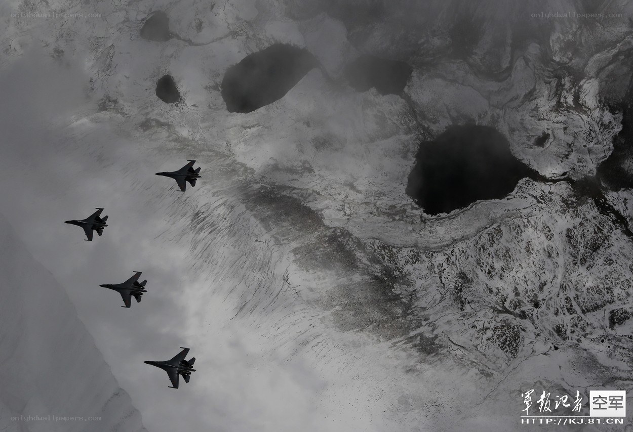 Fighter jets over snowy terrain