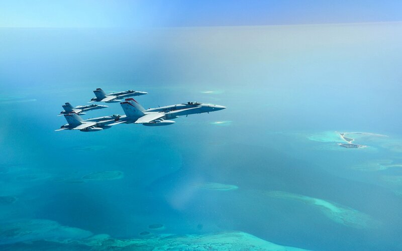 Fighter jets over tropical islands