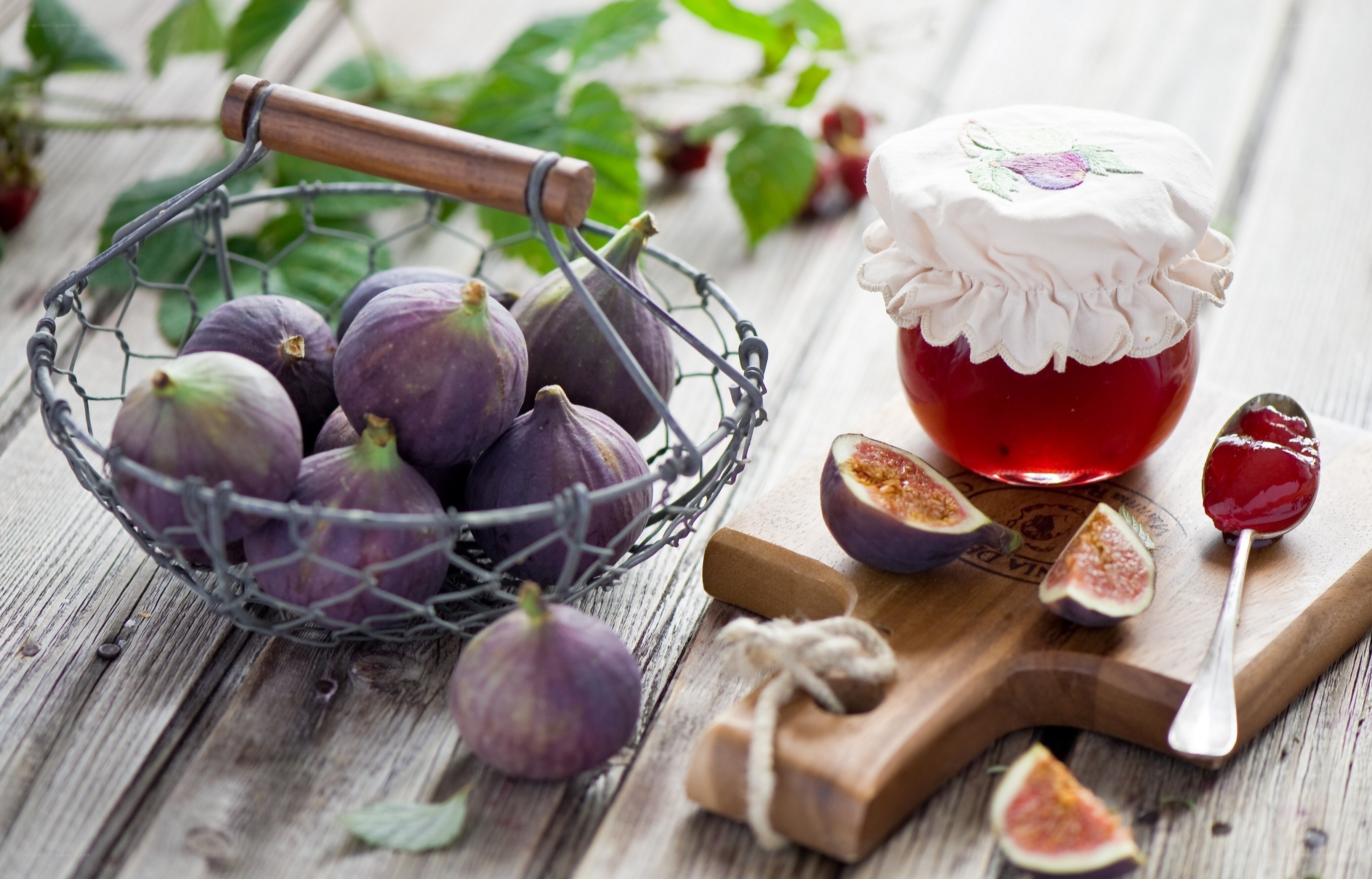 figs and jam on wooden table