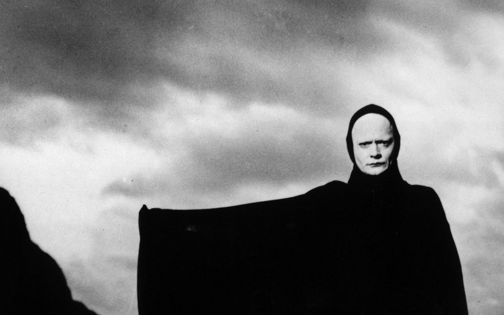 figure in black cloak