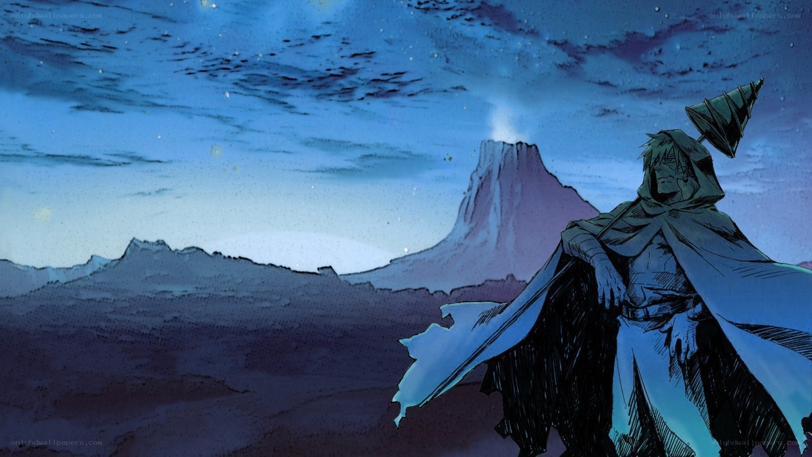figure in cloak on mountain