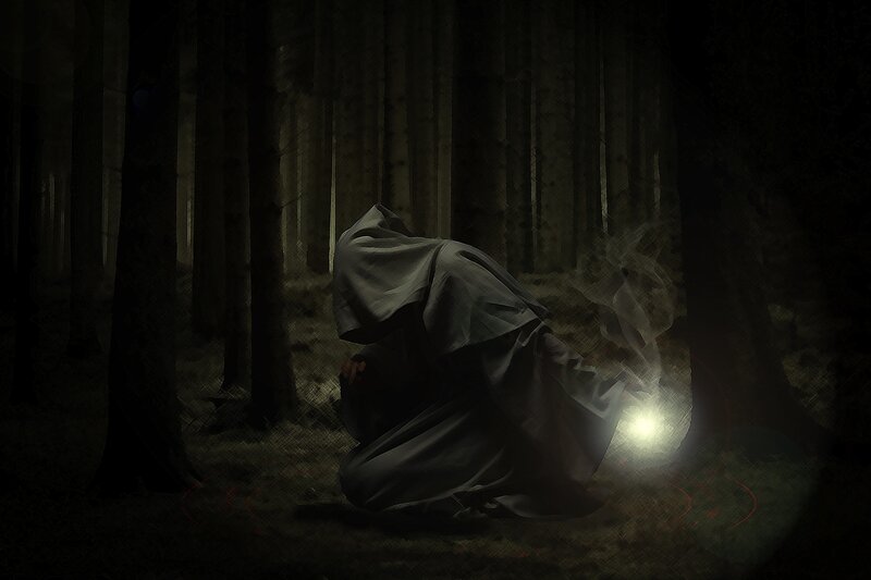 figure in dark forest
