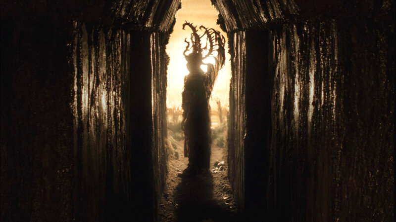 figure in dark tunnel
