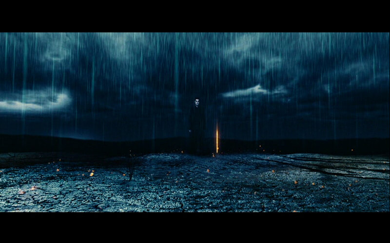 figure in rainstorm at night