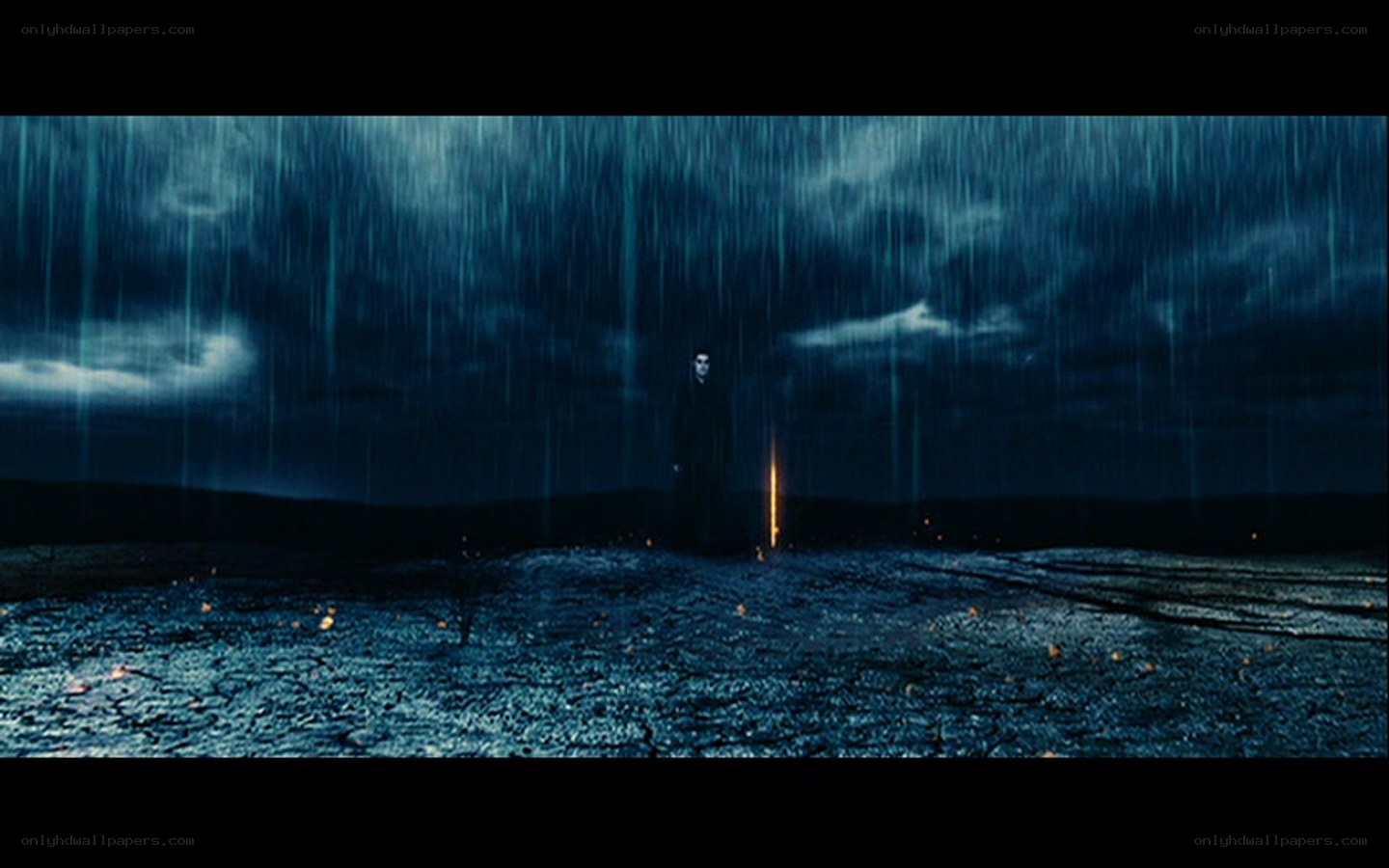 figure in rainstorm at night