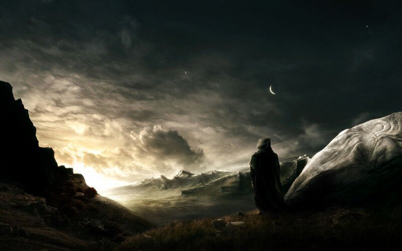 figure on a mountain at dusk