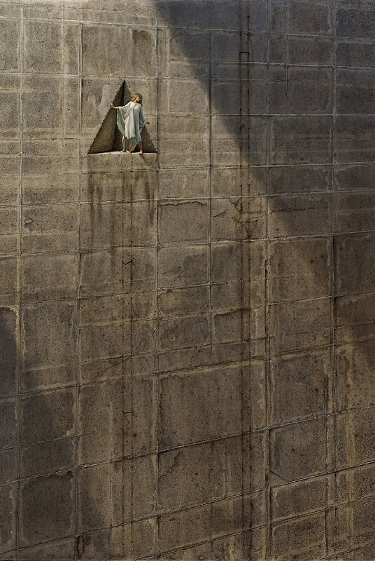 Figure on a stone wall