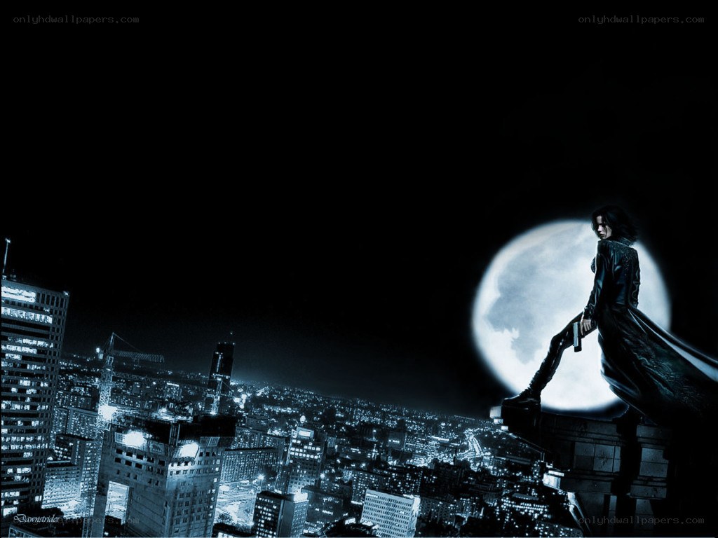 figure on rooftop at night