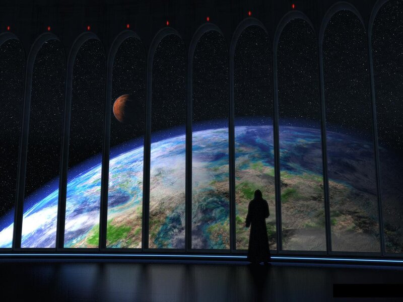 Figure silhouetted before planet view
