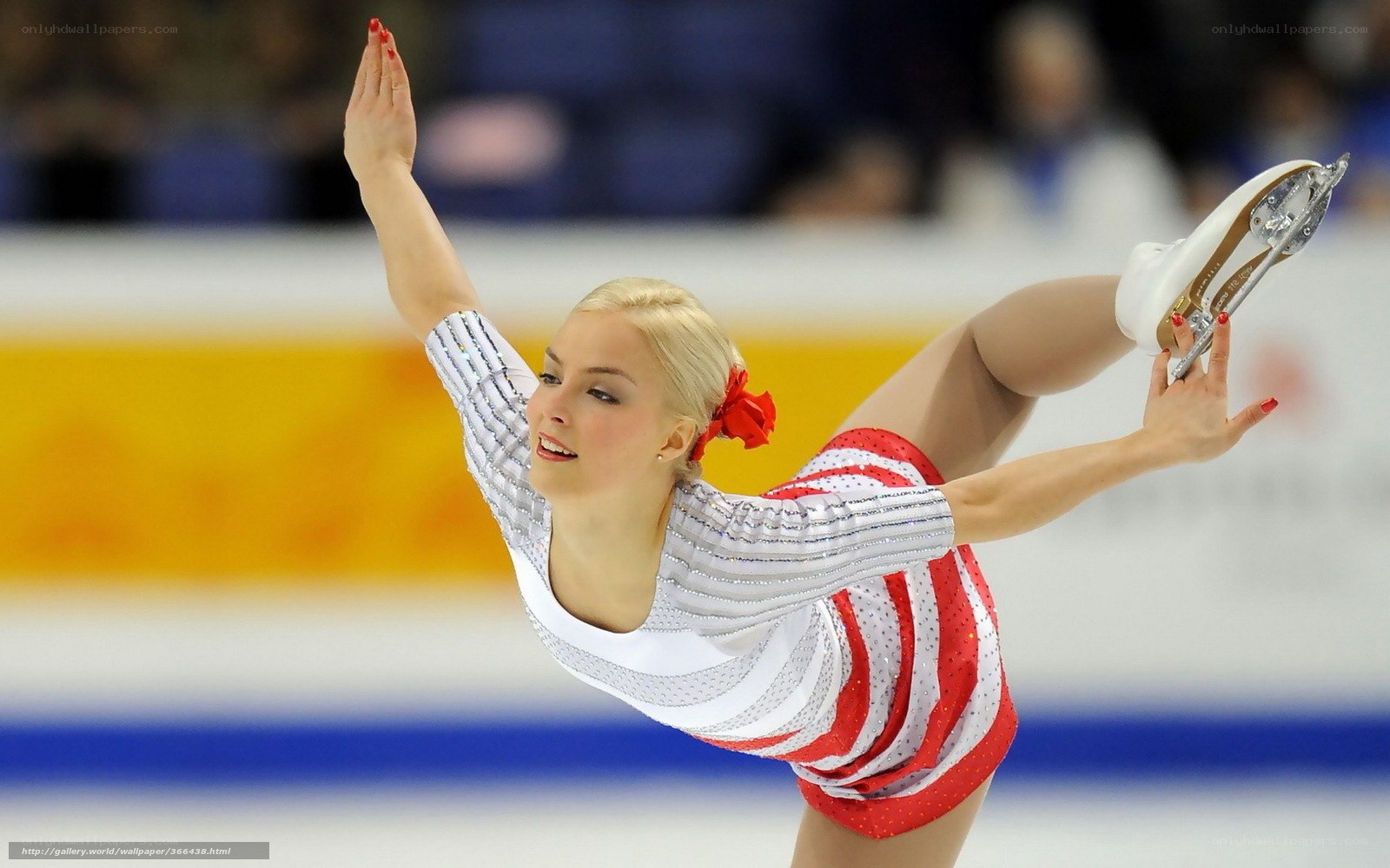 figure skater in red and white costume
