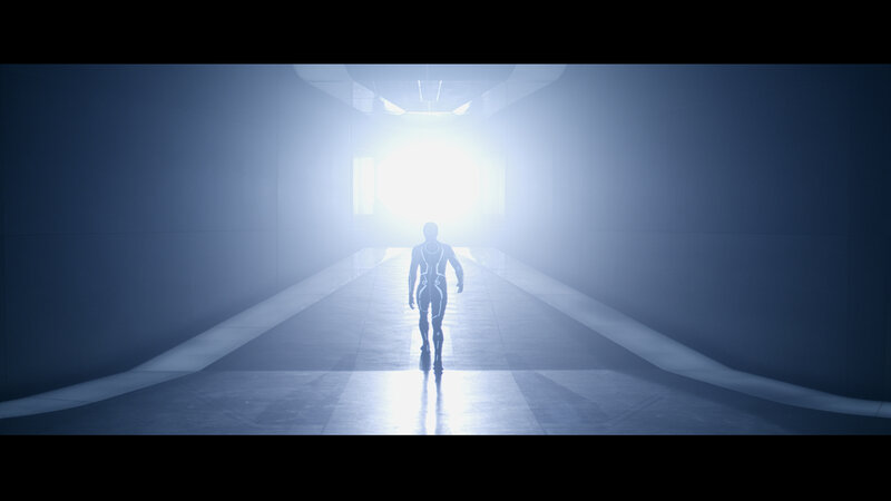 figure walking toward light