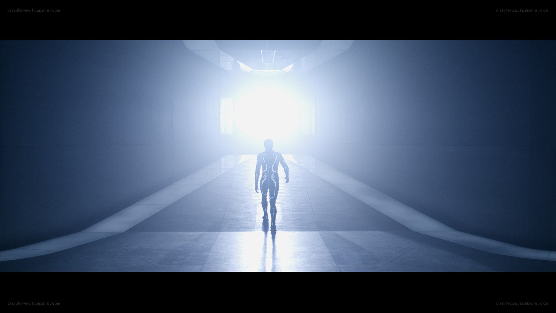 figure walking toward light