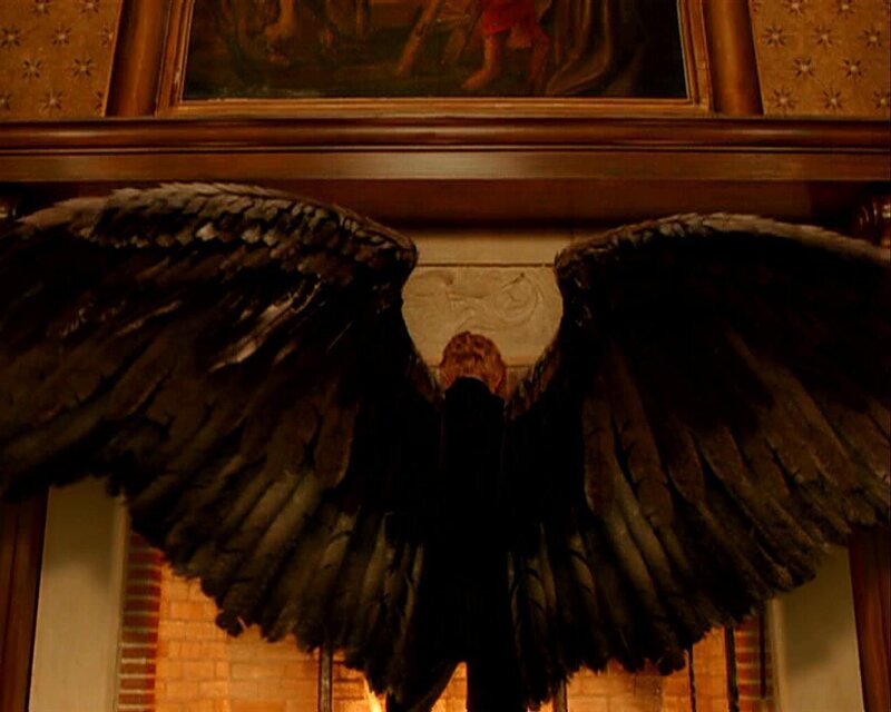 figure with large wings
