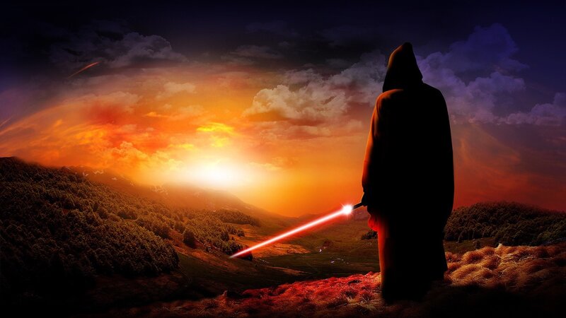 Figure with lightsaber at sunset