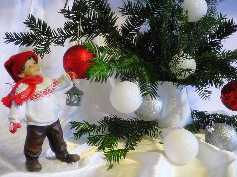 Figurine Boy Decorating Tree