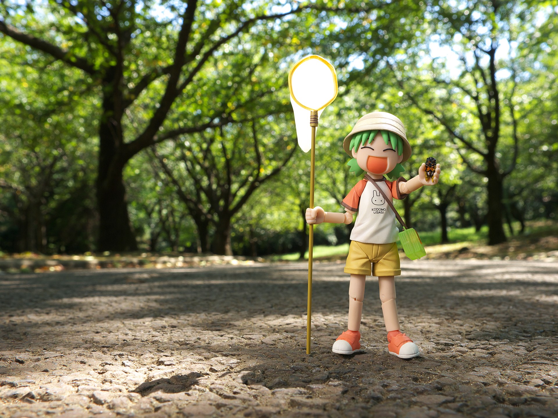 figurine in park with net