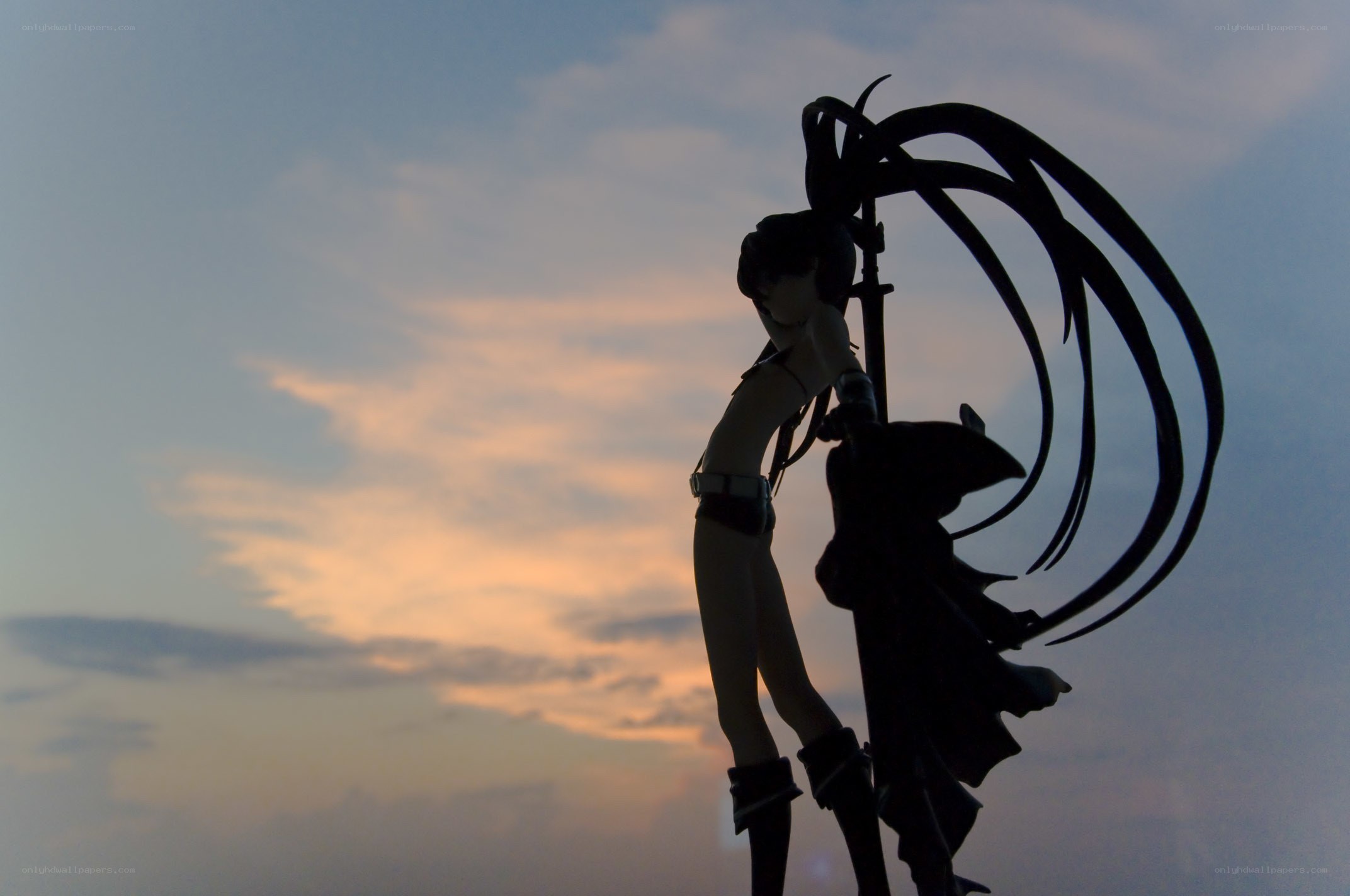 figurine silhouette at sunset