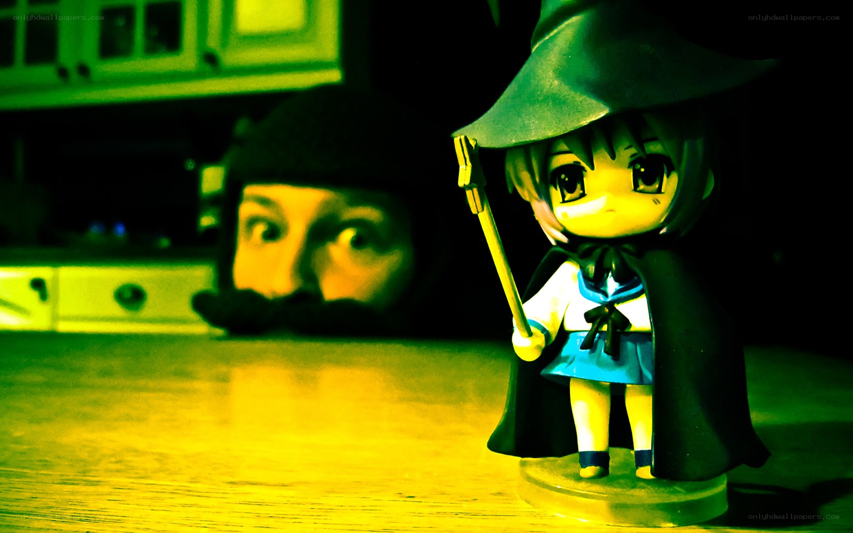 figurine with a man in background