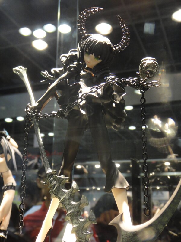 figurine with chains and horns