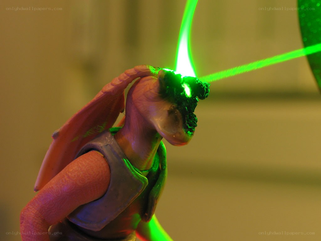 figurine with green laser