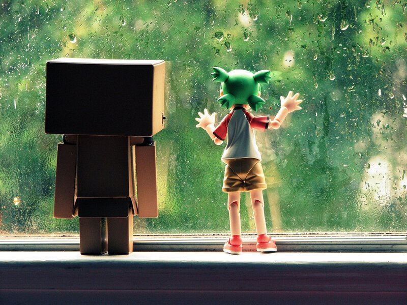 figurines by rainy window