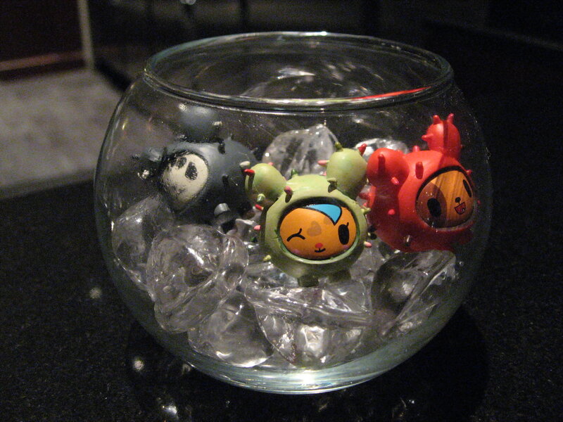 figurines in a glass bowl
