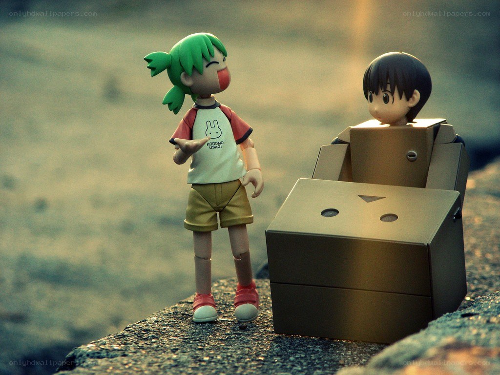 figurines on a rocky shore