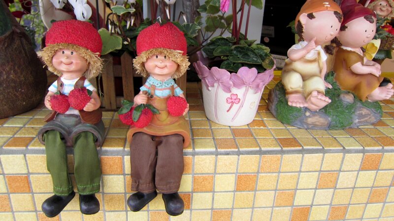 Figurines on Tiled Surface