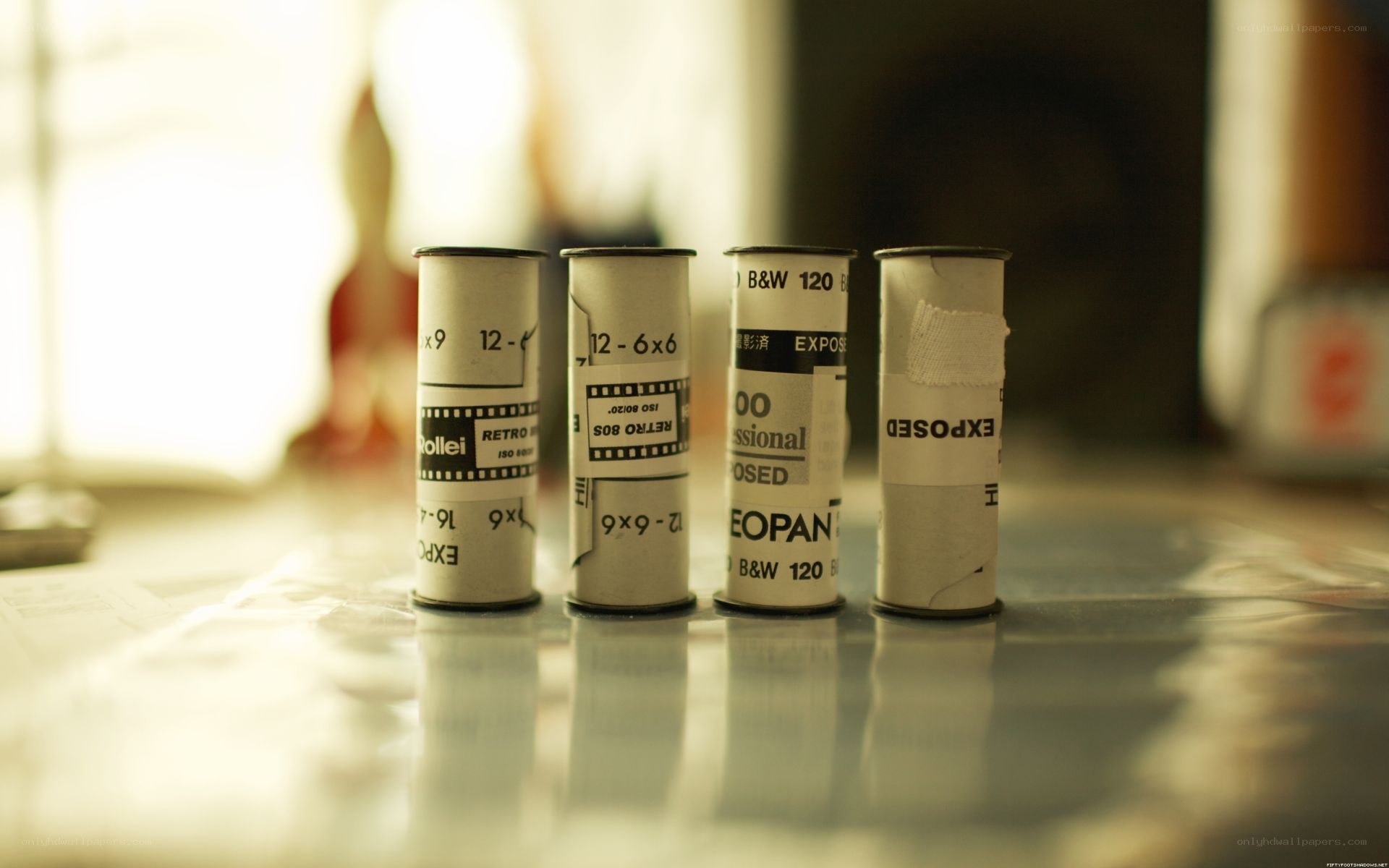 film rolls on a reflective surface