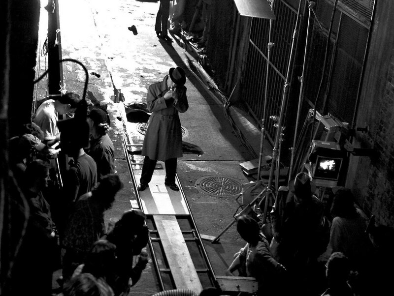 Filming a scene in an alley