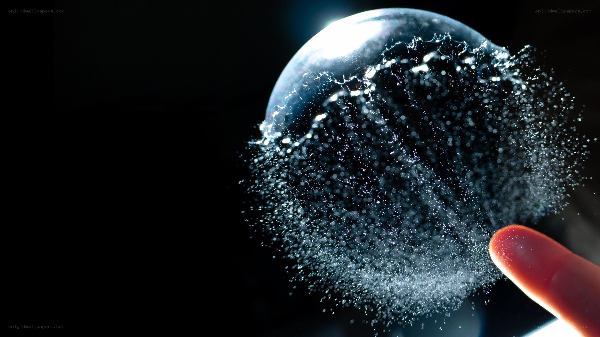 finger popping a water bubble
