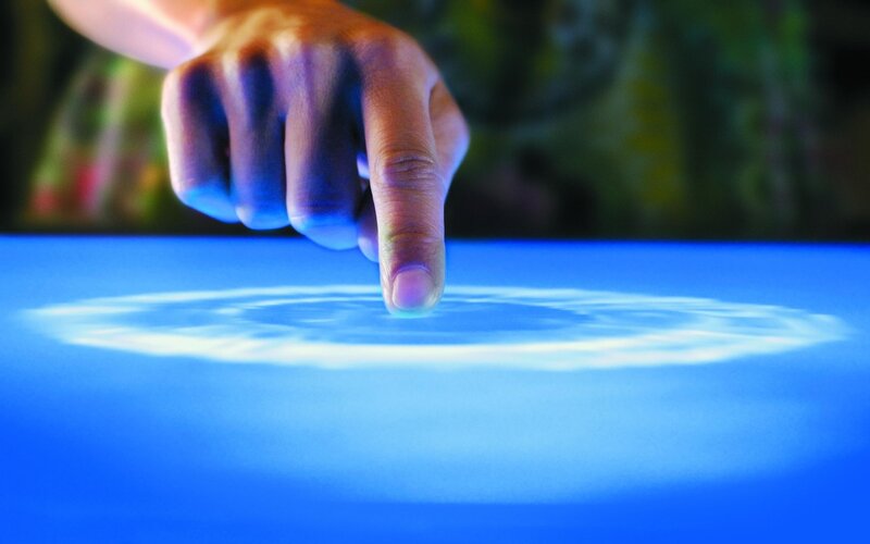 Finger Touching Blue Surface — Calm