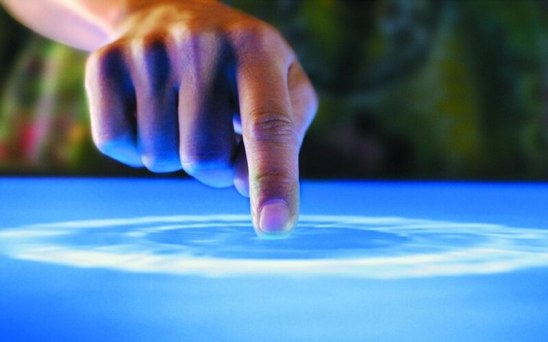 Finger Touching Digital Surface — Blue