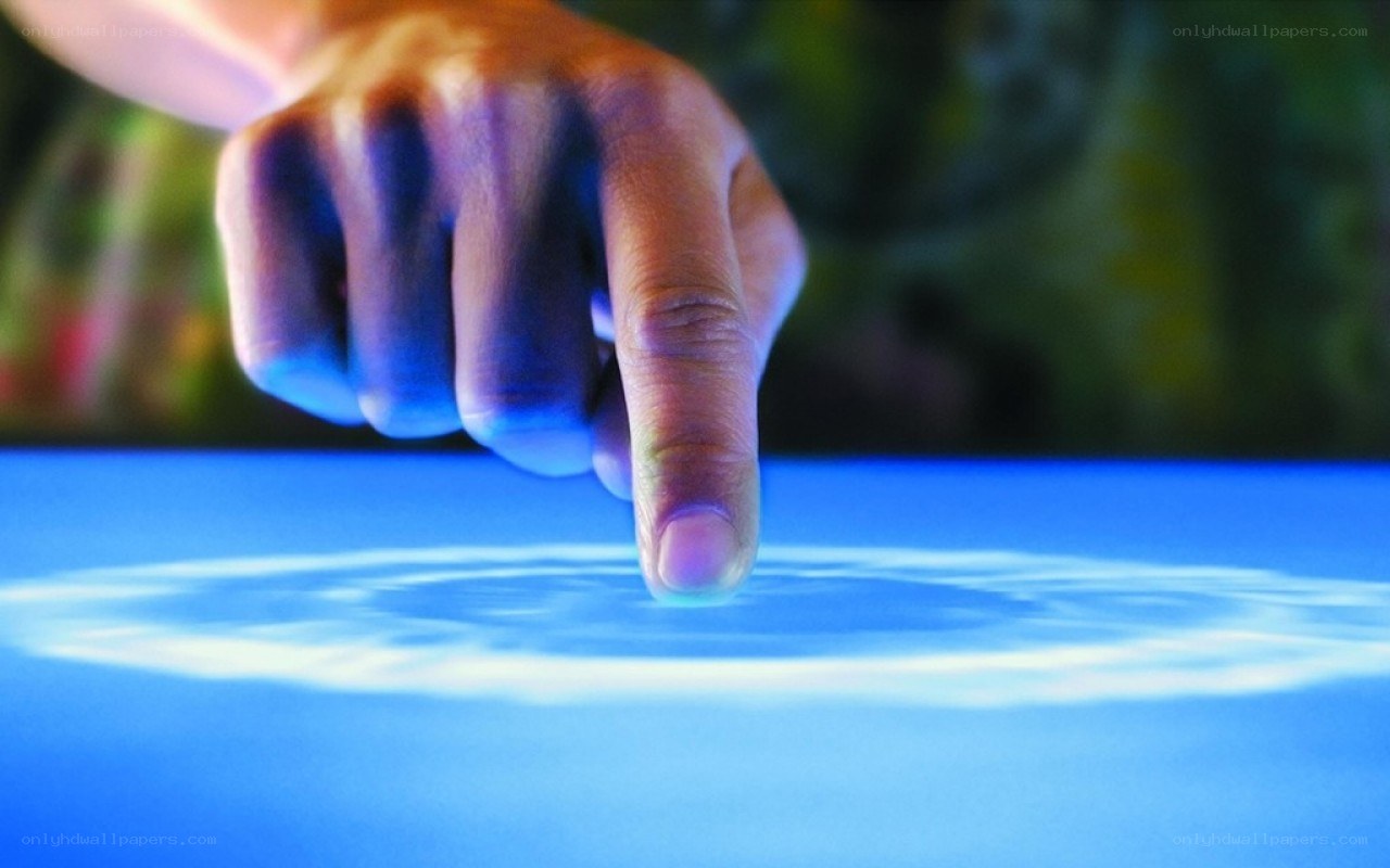 finger touching interactive surface