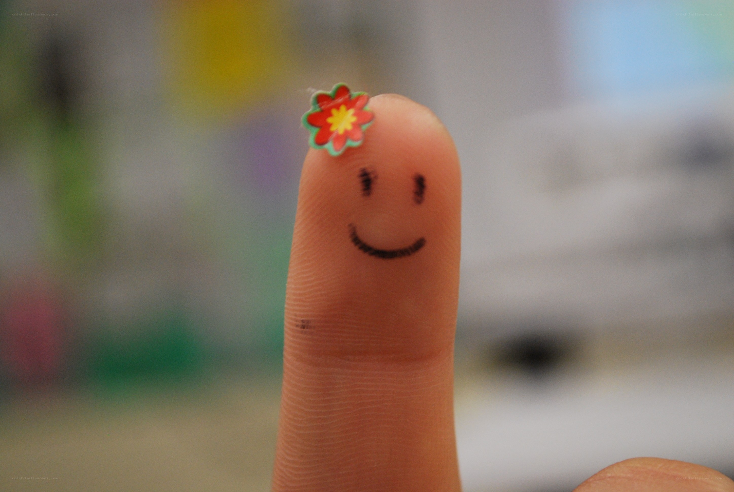 finger with smiley face