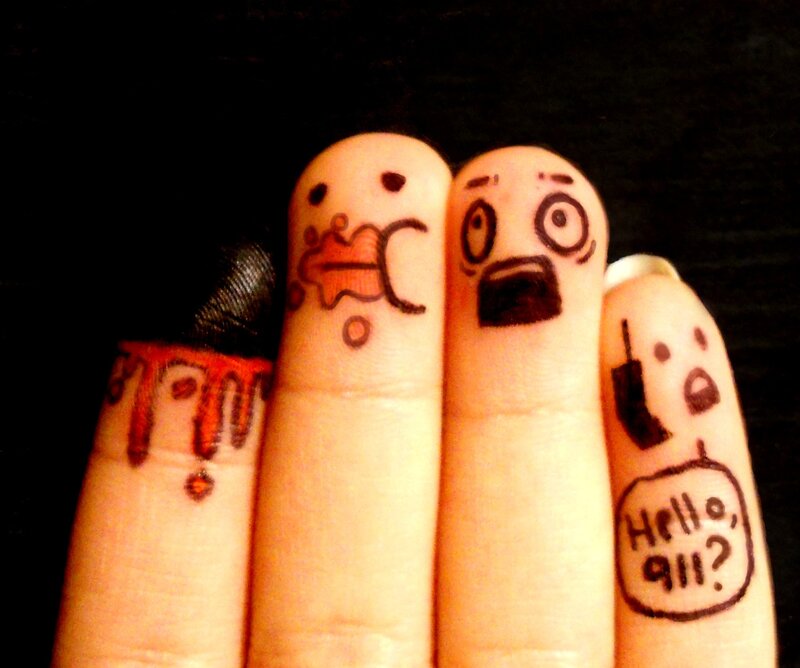 fingers with drawn faces