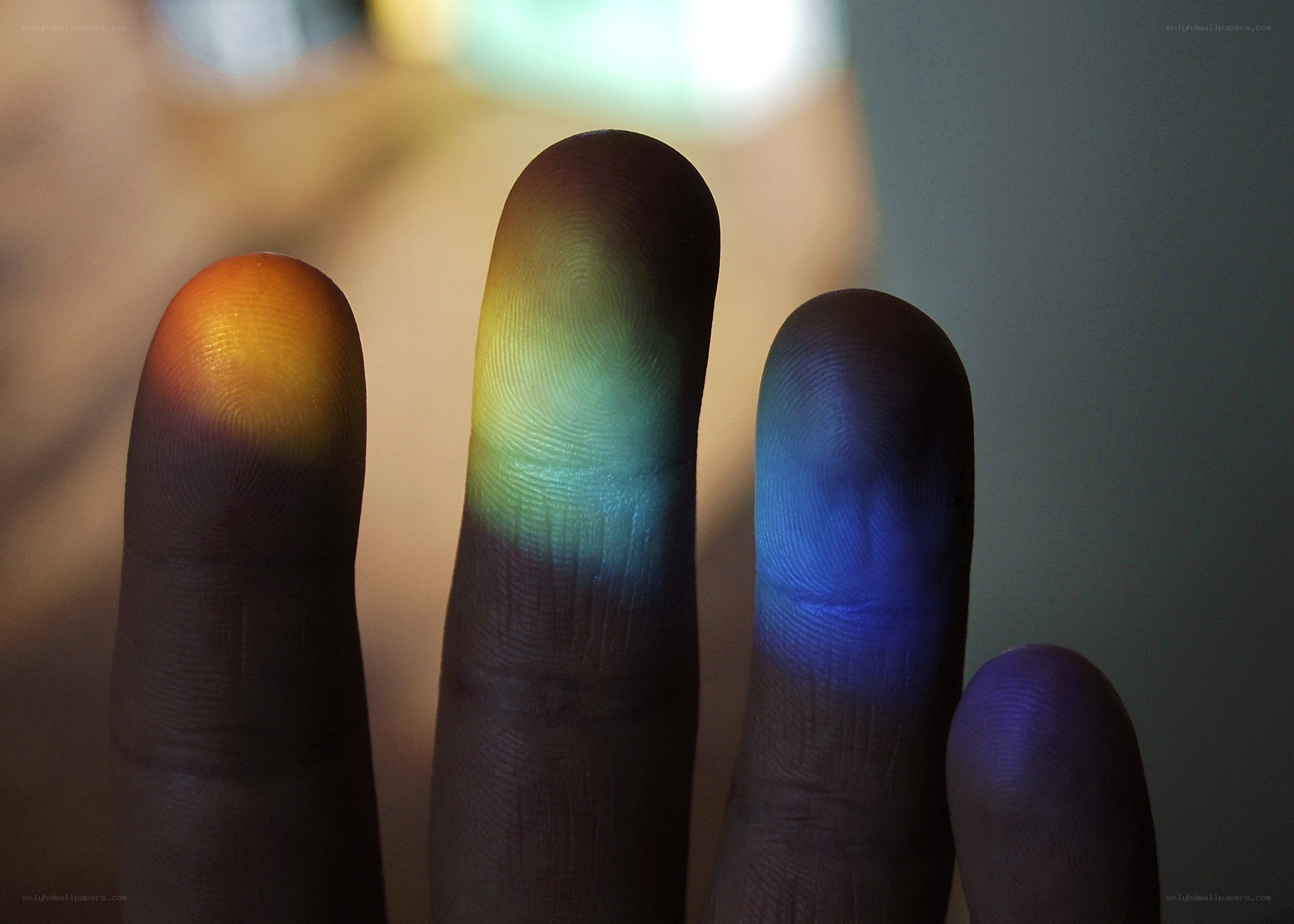 fingers with rainbow light