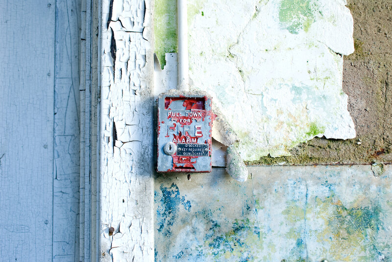 Fire alarm on weathered wall