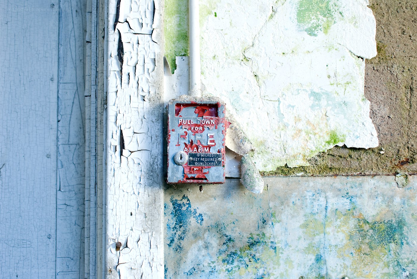 Fire alarm on weathered wall