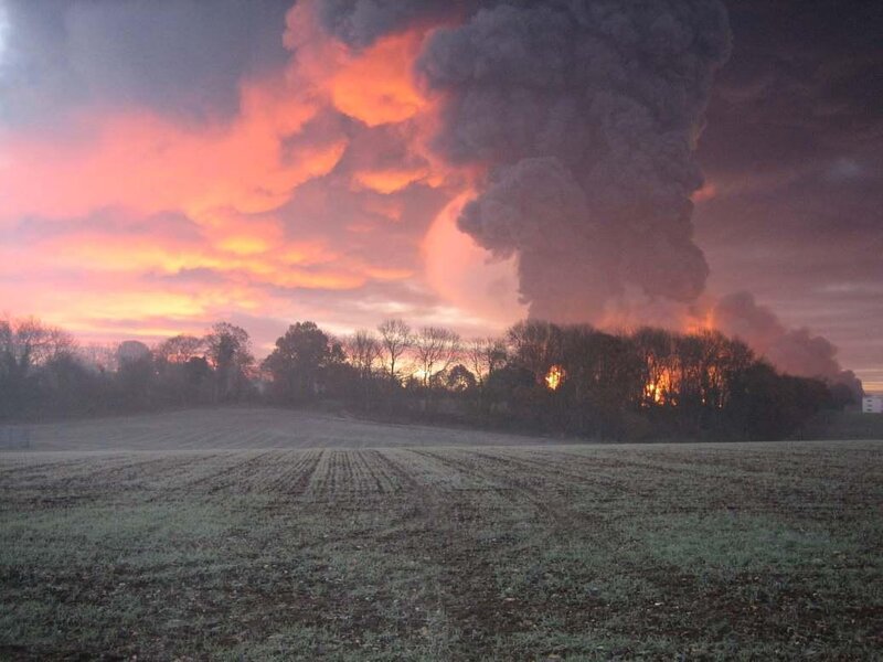 Fire and smoke over a field