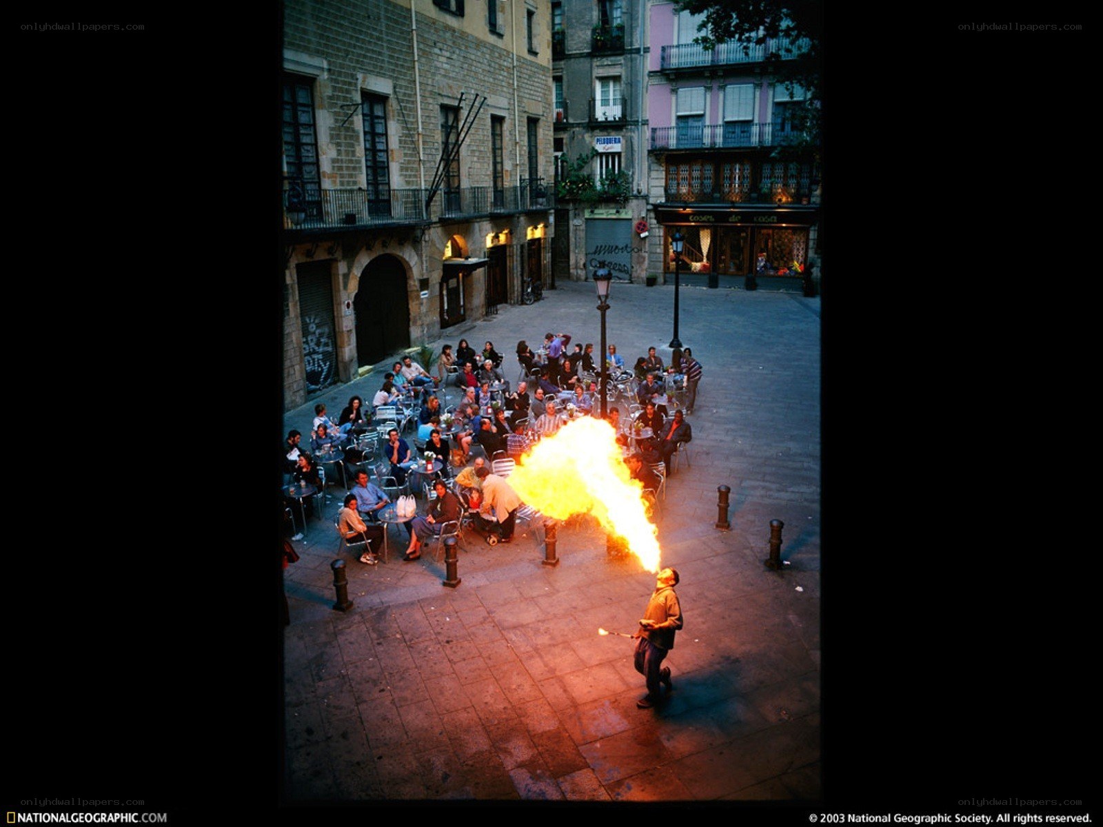 Fire breather performs in plaza